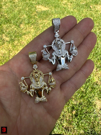 Men Showing 14k White And yellow Gold Anubis Pendant Necklace on Hand  with beautiful shine 