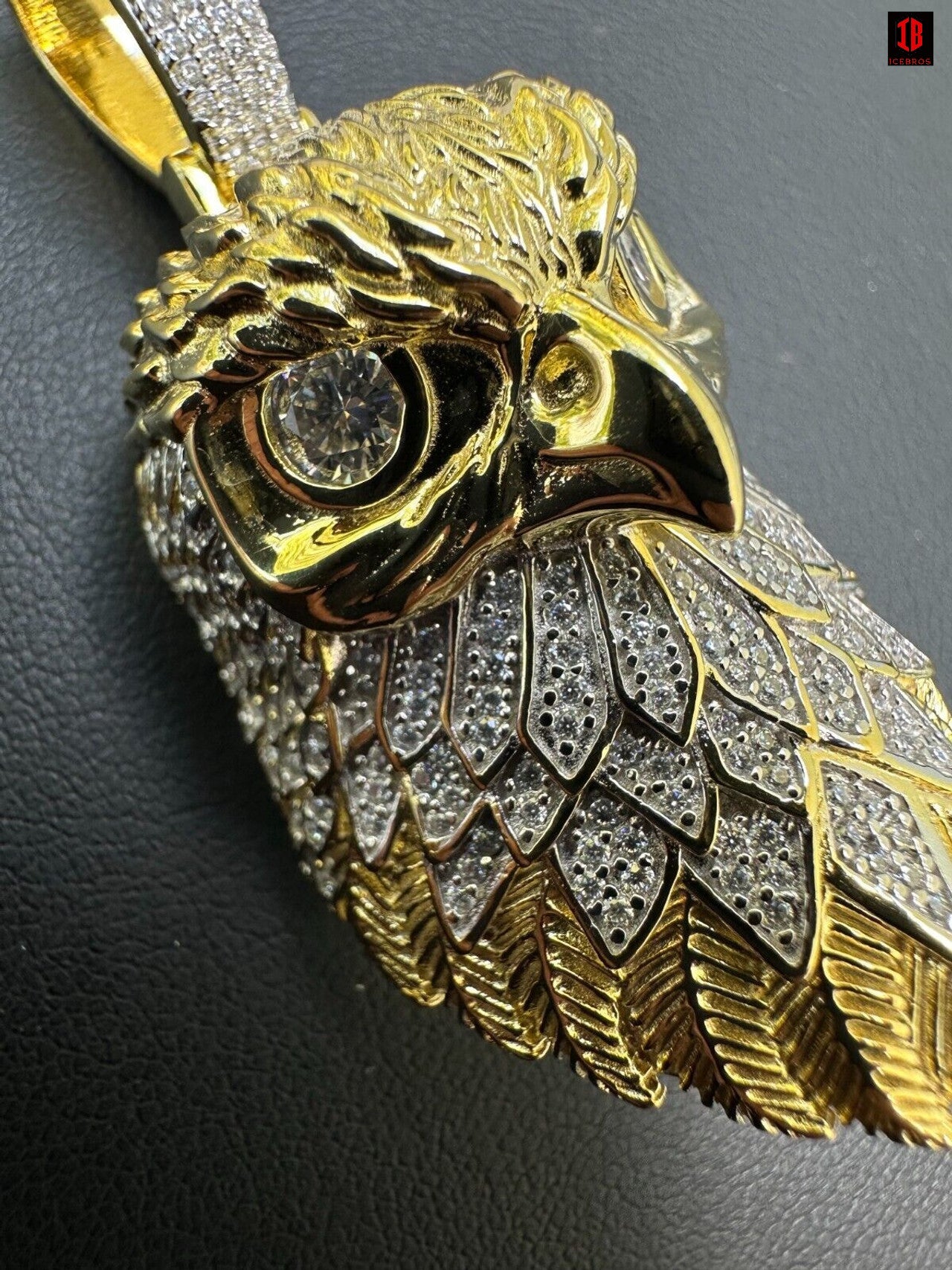 A Detailed View Of 14k Yellow Gold 3D Bald Eagle Pendant Necklace Showing Sparkling  VVS Moissanite  Diamond in eyes and on Feathers 