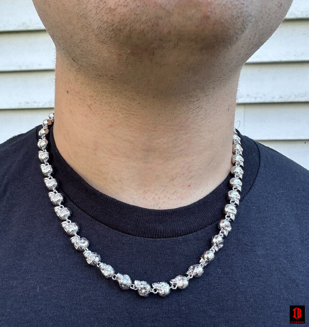 Man model Wearing Moissanite Skull Necklace in his neck 