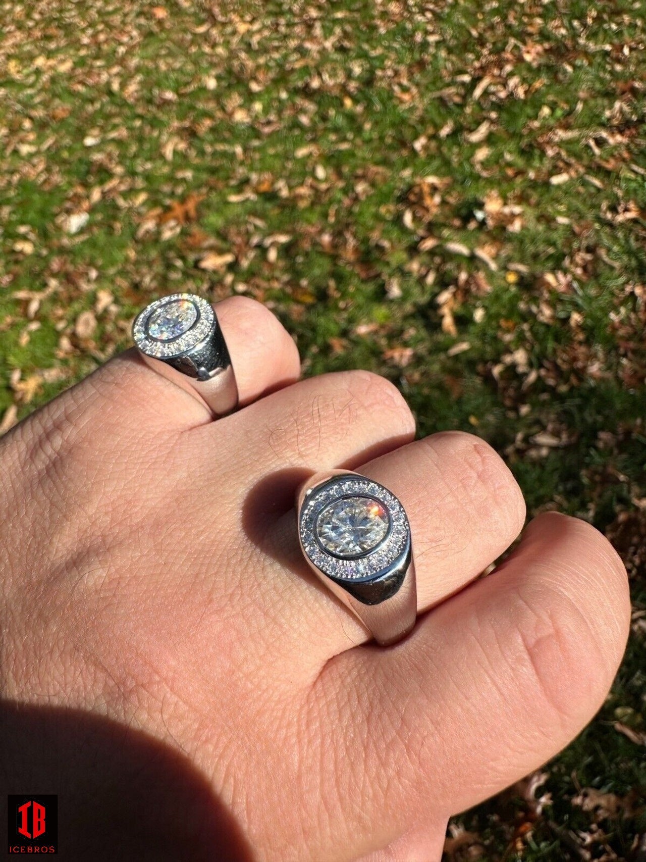 A men Wearing two Sizes of  beautiful Oval Cut Diamond Moissanite Ring  in hand