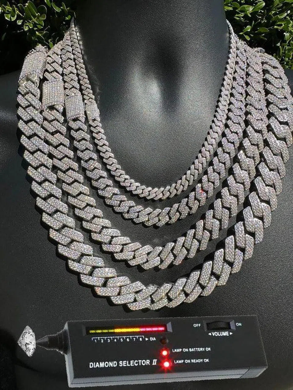 White Gold Cuban Link Chain Being Tested with a Diamond Tester for Authenticity