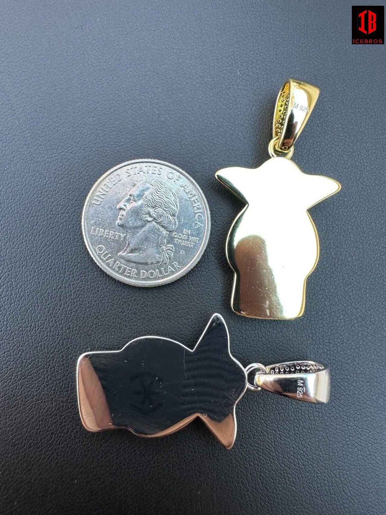 The Back of Baby Yoda Pendant with 925 Stamped on it Being compared with silver coin