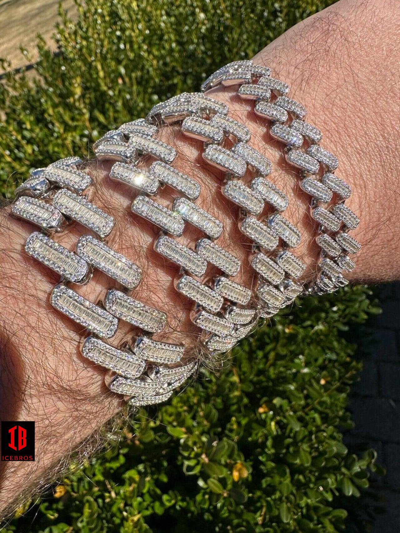 A dapper gentleman flaunts a sparkling diamond bracelet on his wrist, exuding opulence and sophistication.