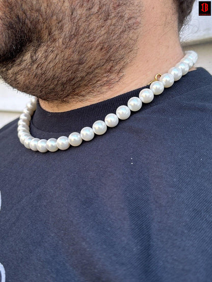 a man wearing white gold cultured pearl necklace 