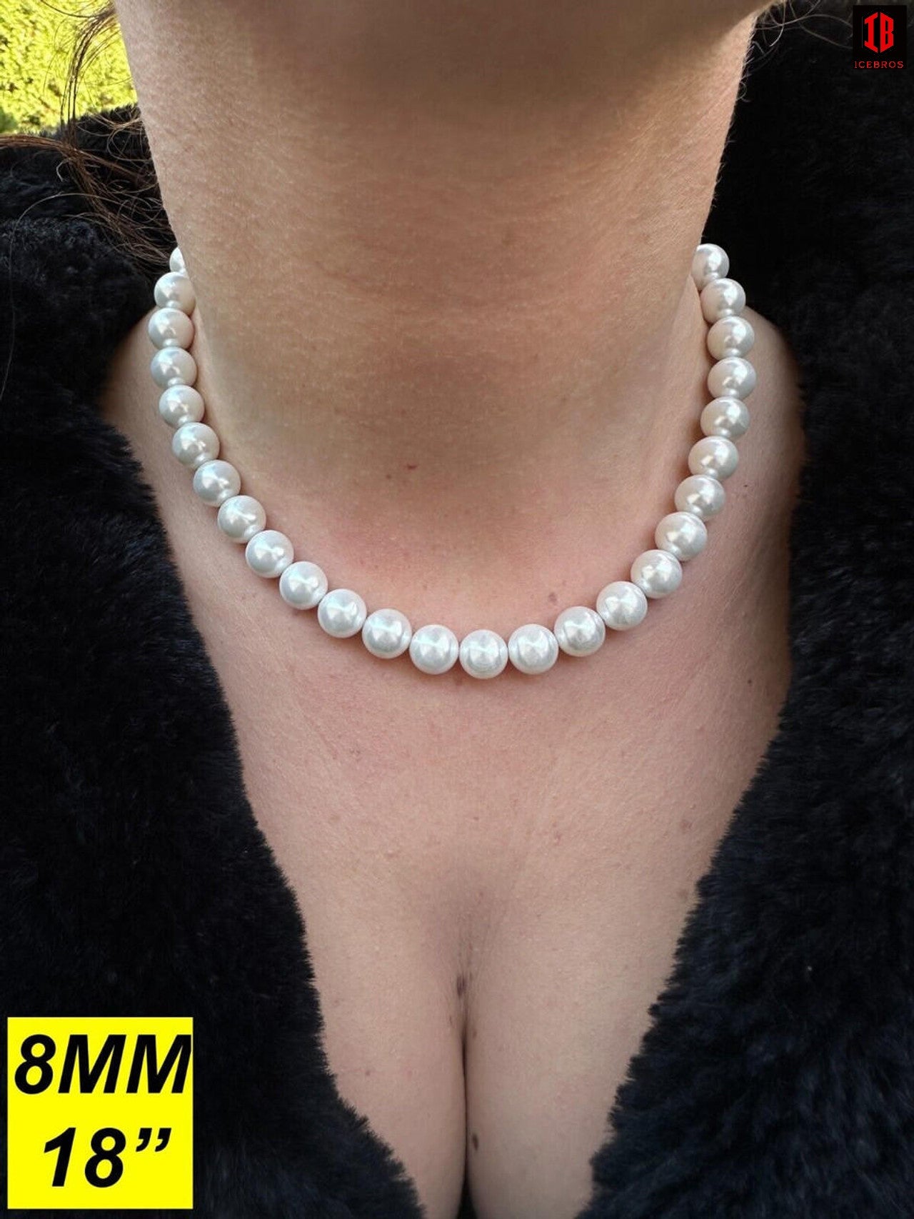 A Detailed View of Women Wearing White Cultured Pearl Necklace 