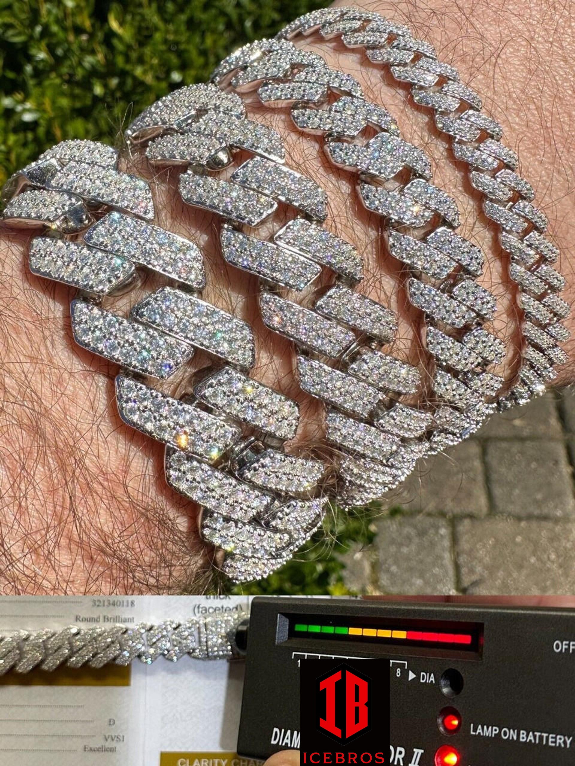 Close-up view of a male hand model wearing a stylish 14k White Gold VVS Moissanite Miami Cuban Link Bracelet in various sizes.