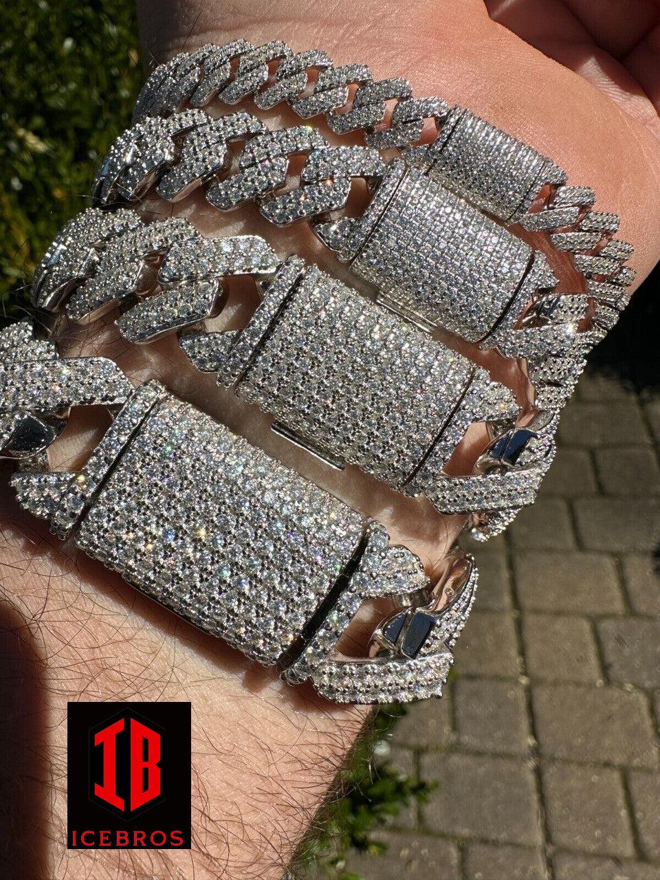 men's hand wearing a 14k  White Gold VVS Moissanite Miami Cuban Link Bracelet of various size. The bracelet is elegantly draped around the wrist, showcasing its exquisite craftsmanship. The focus is on the buckle clasp, emphasizing its security and durability