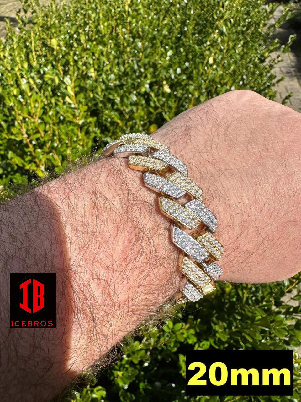 Close-up view of a men's hand model wearing a 14k Yellow & White Gold Two-Tone Miami Cuban Link Bracelet.