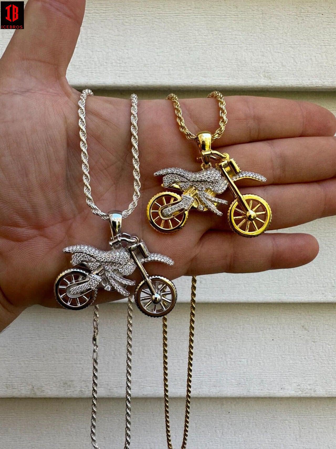 Hand Model Showing 14k White and Yellow Gold Motorcycle Dirt Bike  Pendant Necklace Hanging On Mens hand Showcasing the Rope Chain and Pendant