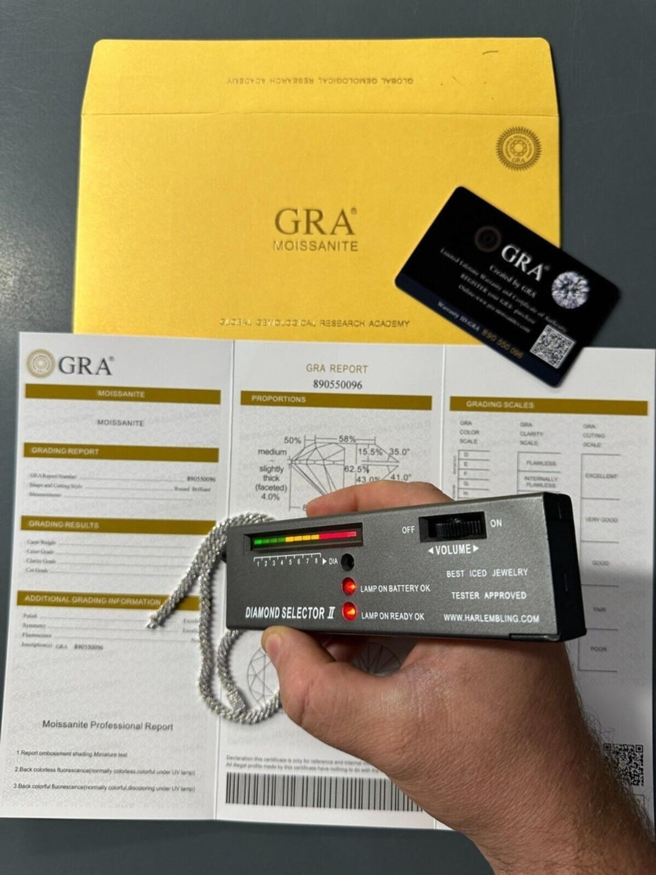 Diamond tester testing the White Gold Micro Iced prong Chain Verified and Certificated By Gra Verification