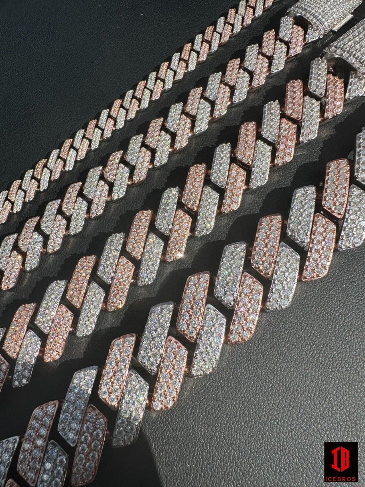 14k Rose & White Gold Miami Cuban Link Bracelet collection displayed on a table. The bracelets come in various sizes and styles, showcasing their exquisite craftsmanship and intricate details.