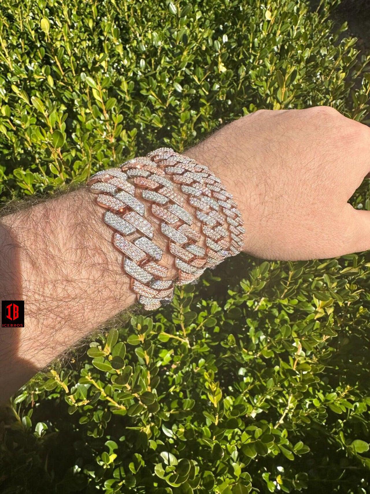  men's hand adorned with a stunning 14k Rose & White Gold Diamond Moissanite Miami Cuban Link Bracelet, showcasing its exquisite craftsmanship and timeless design .