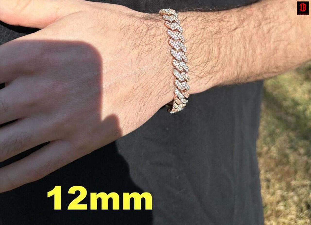 Close-up image of a men's hand wearing a stunning 14k Rose & White Gold Diamond Moissanite Miami Cuban Link Bracelet. The bracelet features intricate links and sparkles with brilliant diamonds and moissanite stones, making it a luxurious and eye-catching accessory.