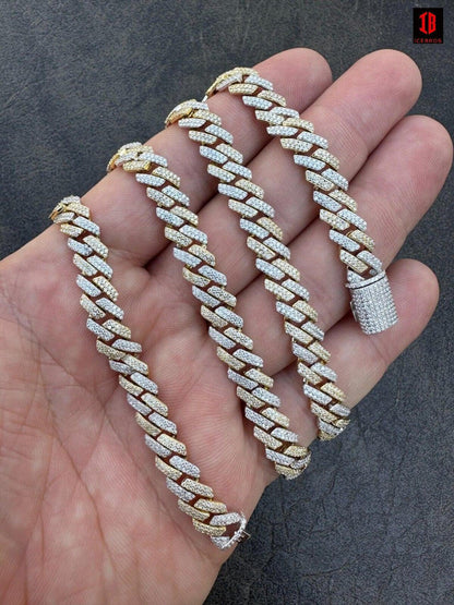 Gold and White Two-Prong Cuban Link Chain Displayed on Hand - Stylish Two-Tone Gold and White Cuban Link Chain Jewelry for Men and Women