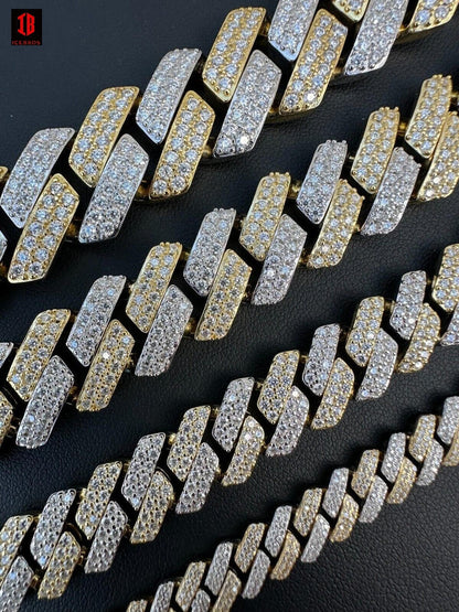 A gold and white two-prong Cuban link chain, available in various sizes. The image shows the front  of the chain