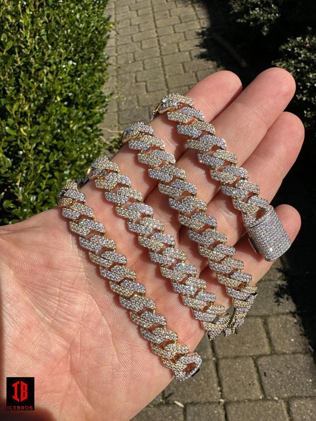 Gold and White Two-Prong Cuban Link Chain Placed on Hand