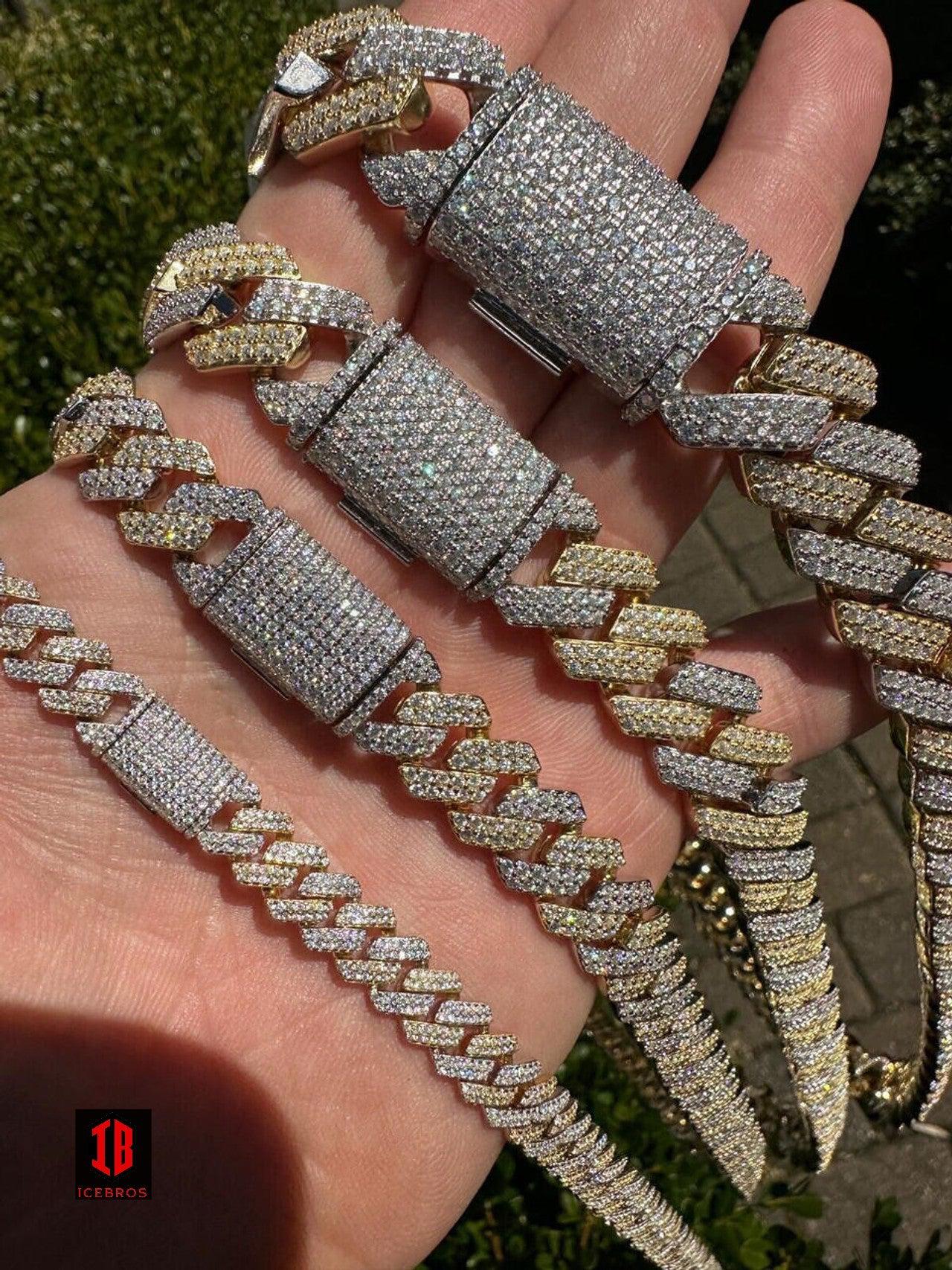 Two-Prong Cuban Link Chain in Gold and White, Clasp Closed Around Hand