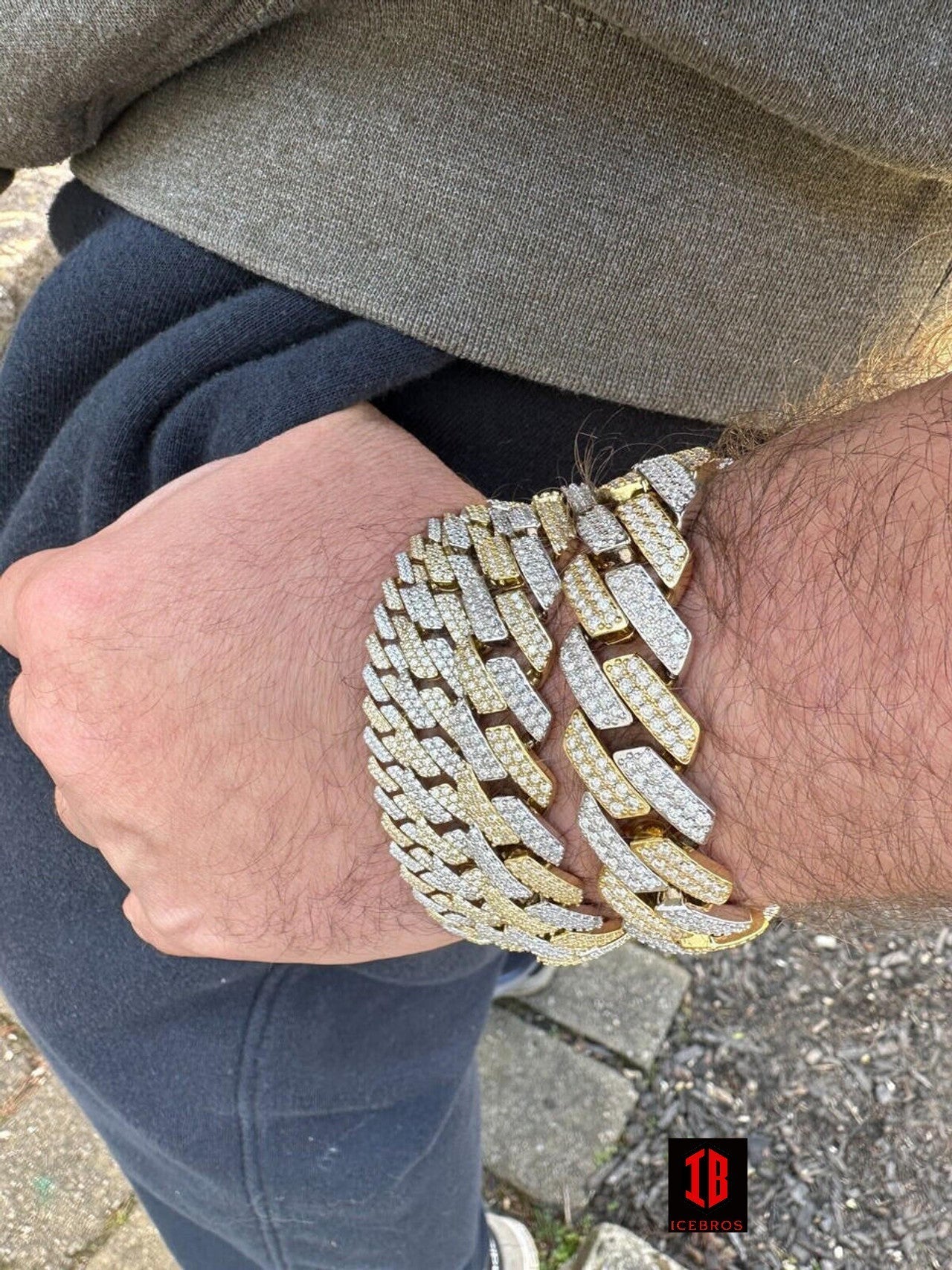 luxurious 14k Yellow & White Gold Miami Cuban Link Bracelet adorned with brilliant VVS Moissanite stones of various sizes, showcasing exquisite craftsmanship and design