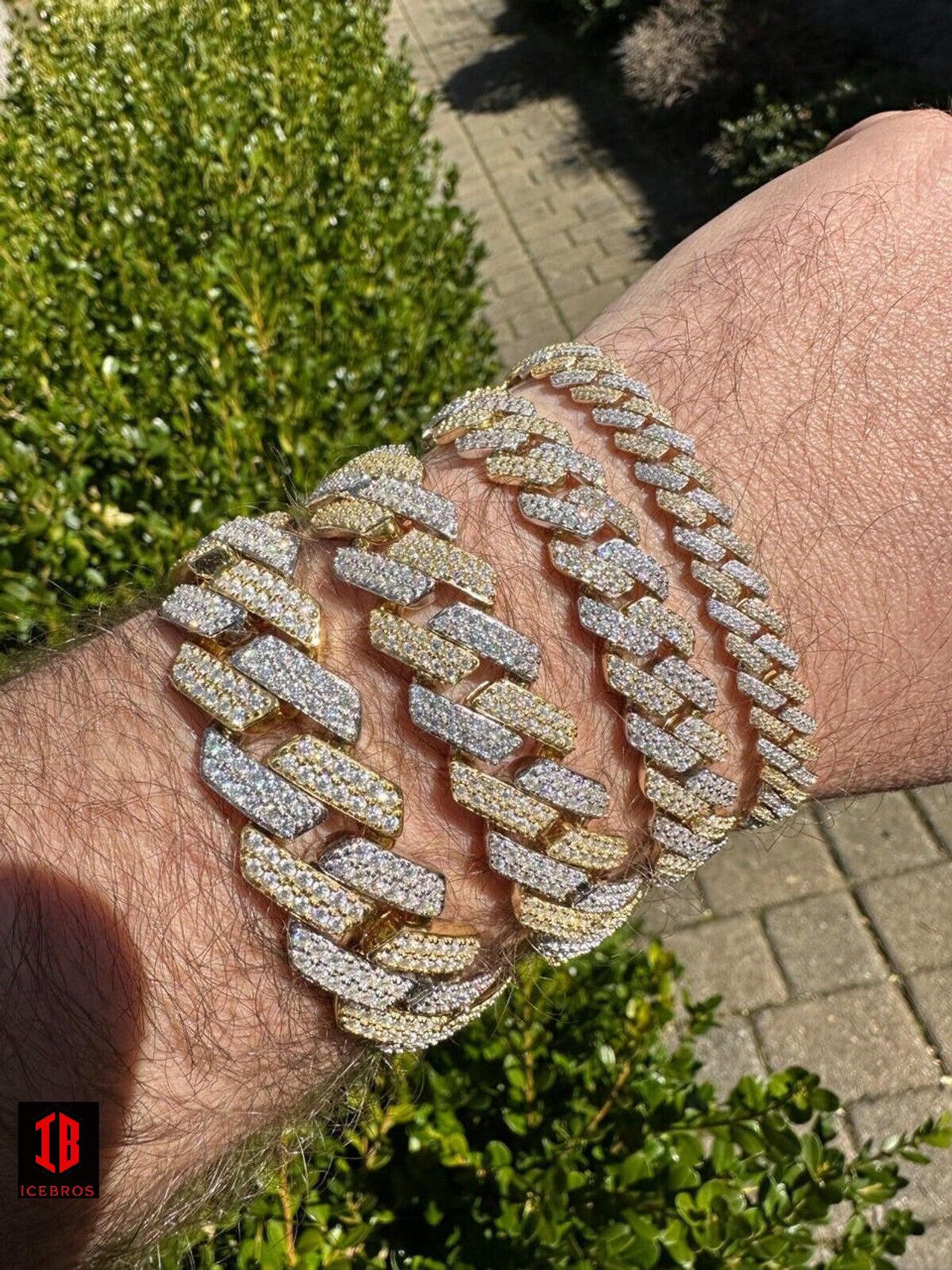 men's hand adorned with a stunning 14k Yellow & White Gold Diamond Moissanite Miami Cuban Link Bracelet, showcasing its exquisite craftsmanship and timeless design