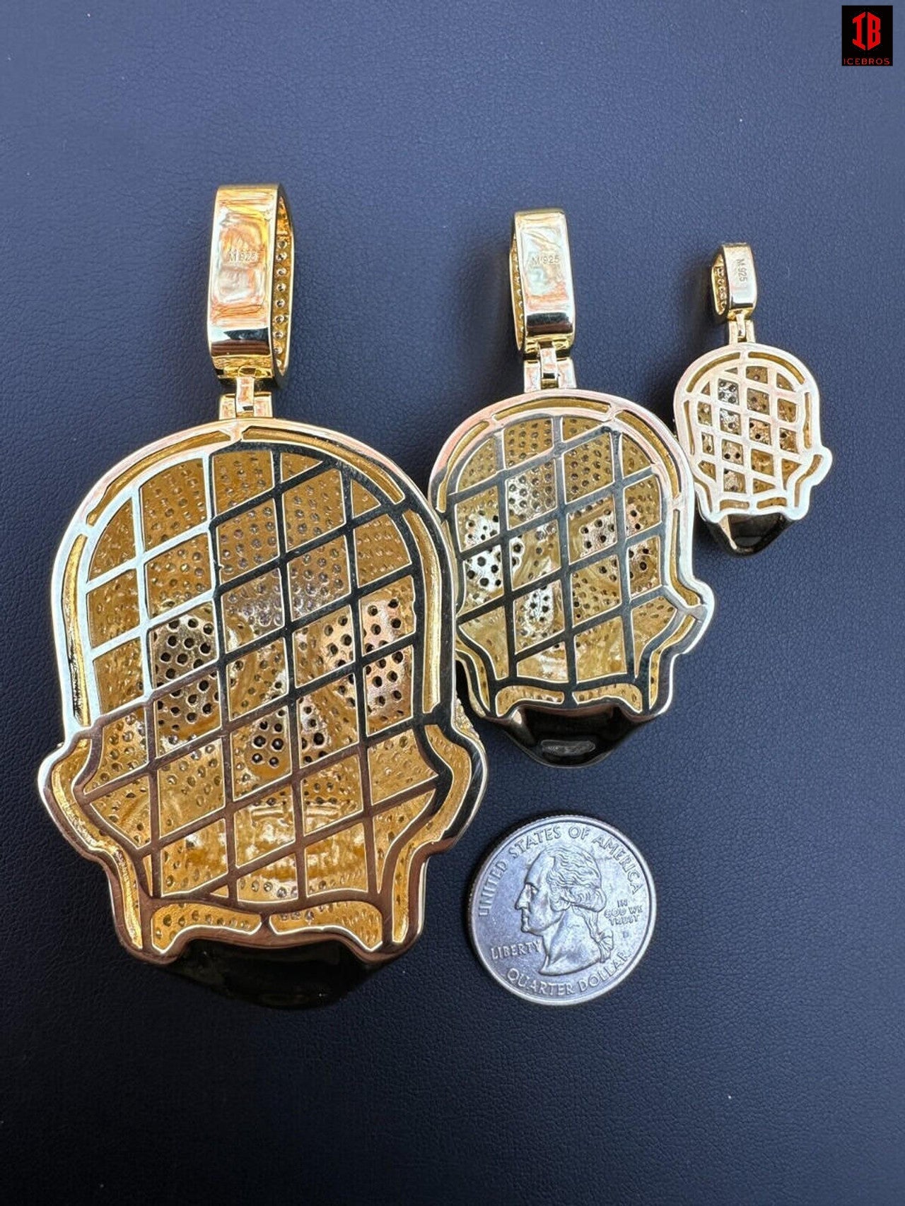 The Back Side of three Different Sizes of 14k Gold Over 3D Skull Pendants 