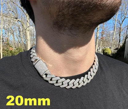 White Gold Cuban Link Chain, elegantly displayed on a male model. The chain exudes luxury and masculinity, with its intricate links