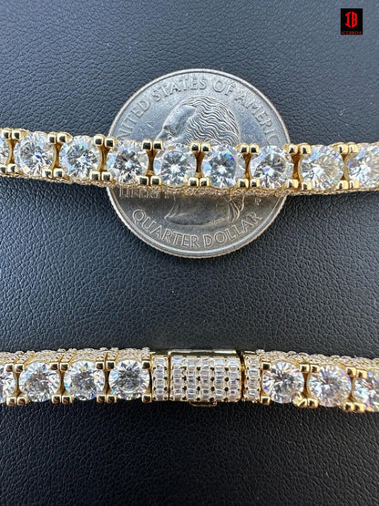 Stunning close-up view of a Yellow Gold Tennis Bracelet  featuring VVS Moissanite Diamonds. This elegant bracelet embodies the timeless appeal of a tennis bracelet and the allure of baguette diamond accents. A luxurious piece of jewelry crafted in 14k yellow gold, perfect for women seeking a glamorous addition to their collection.