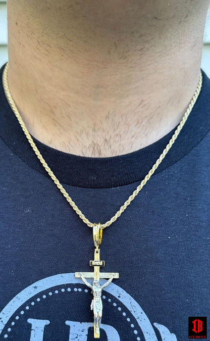 A man wearing 14k Gold Cross Jesus Piece Pendant 