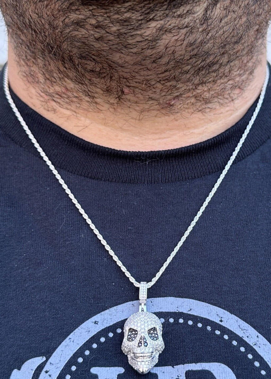 A Men Wearing 14k White Gold Skull Pendant Necklace with White & Black Moissanite Stones with 14k White Gold Twisted Rope Chain 